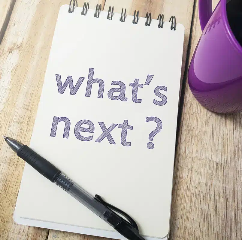 pad of paper with block lettering that says "What's next?"